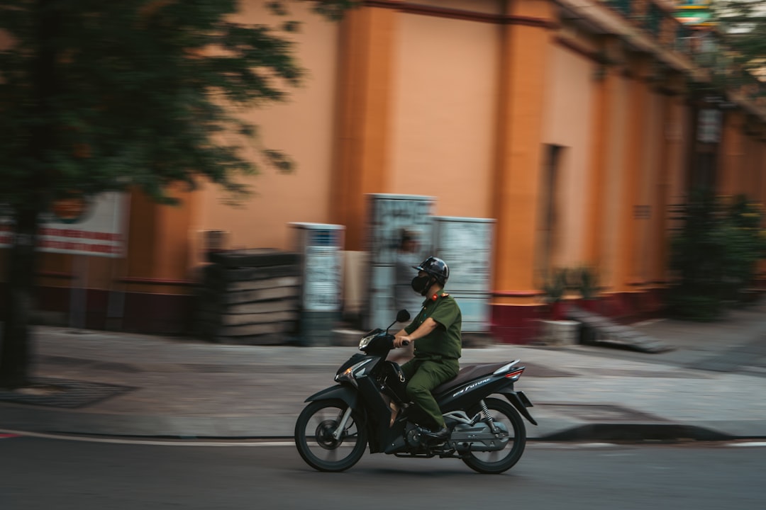 man-in-uniform-rides-a-motorcycle-on-street-ippmztrd89q
